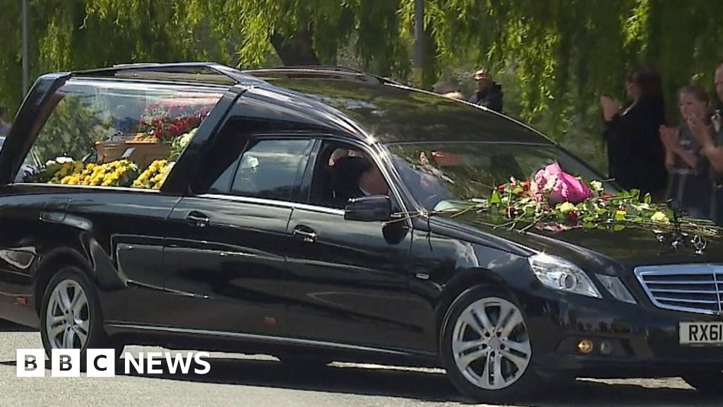 Coronavirus: People line streets to honour Clacton GP at funeral - BBC News