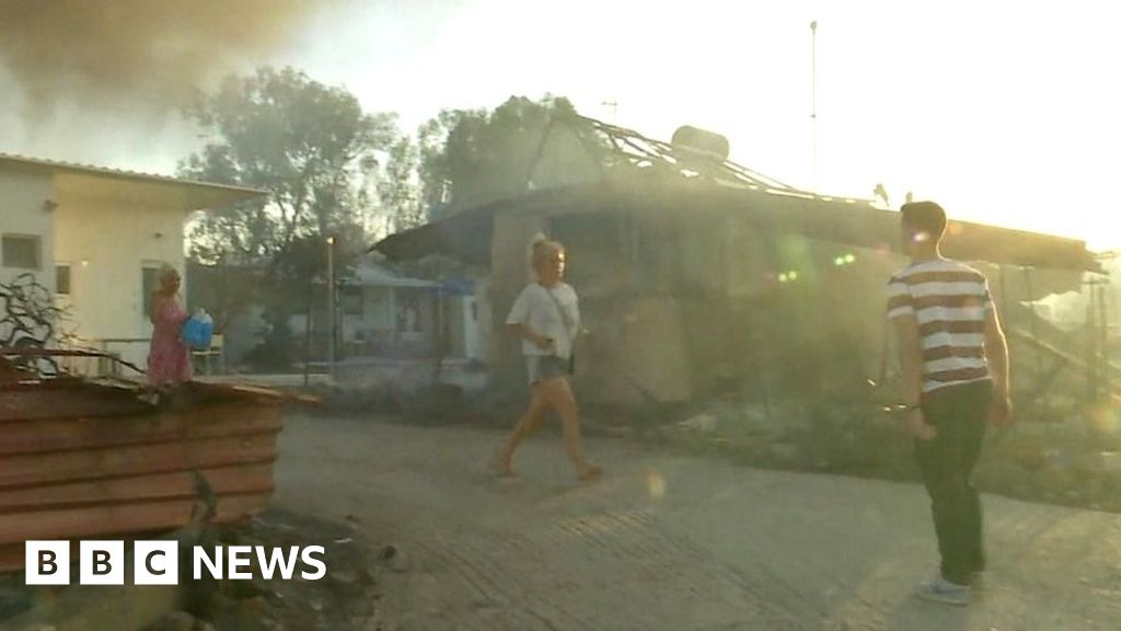 Residents flee burning homes in Rhodes
