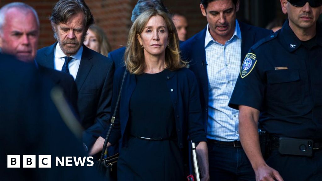 Actress Felicity Huffman begins 14-day jail term for cheating scam