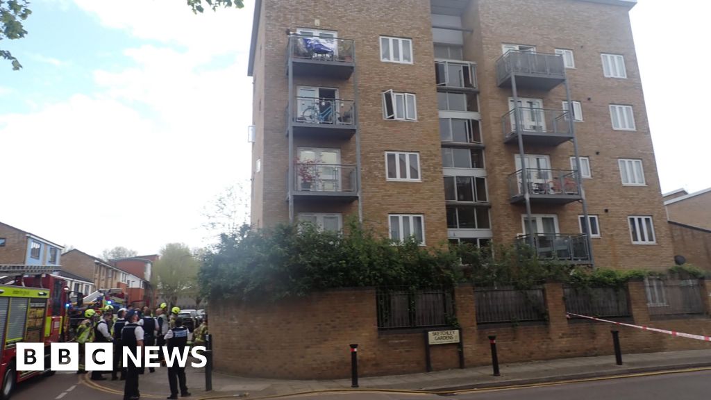 Woman jumps off third floor balcony to escape fire