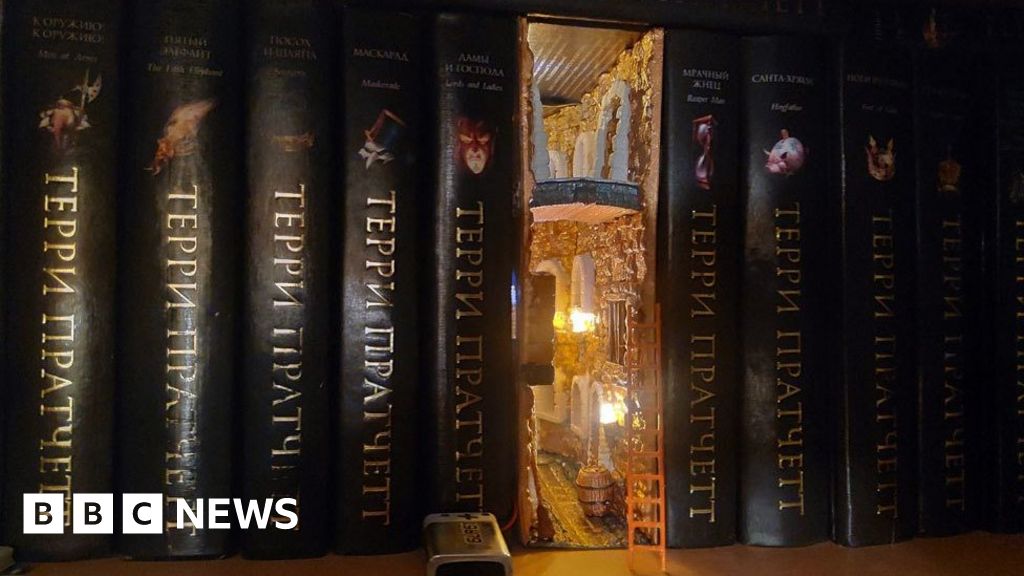 Bookshelf with a little fantasy themed book nook. But what I like best  about this is… everything on that top shelf are copies of things I wrote.  Some duplicates to be given