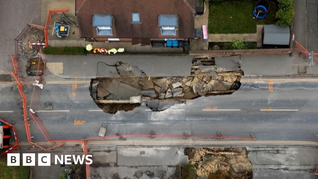 What is a sinkhole and how does it form?