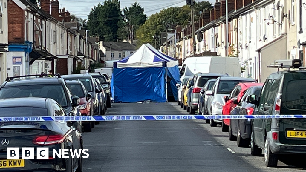 Murder manhunt after two found shot in car