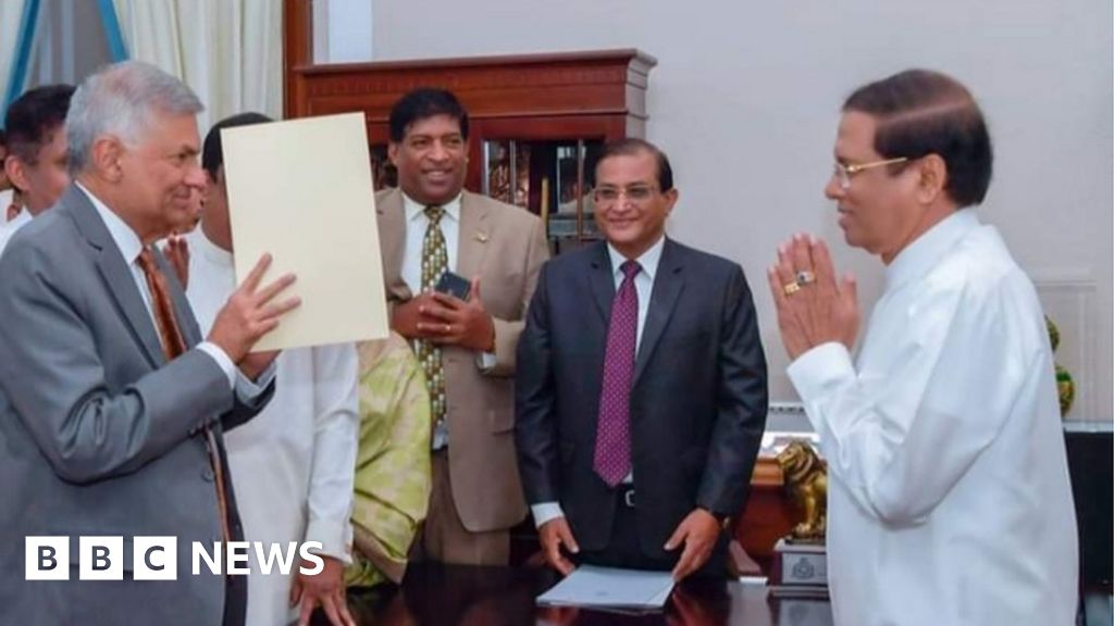 Sri Lanka reinstates ousted PM