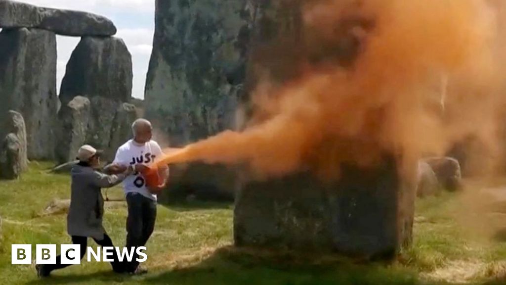 Orange powder paint sprayed on Stonehenge is removed
