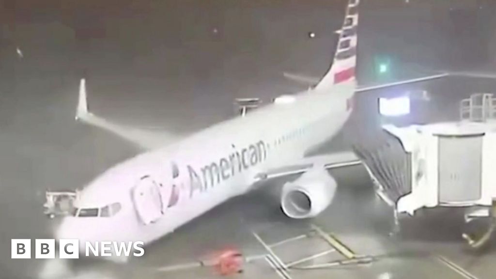 Moment winds push plane away from airport gate in Texas