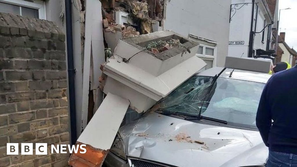 Road shut after car hits building in Halstead BBC News