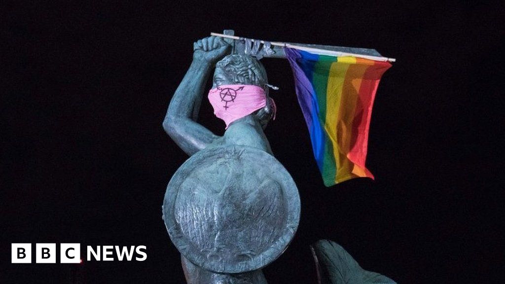 Poland LGBT protests: Three charged with hanging rainbow flags off statues