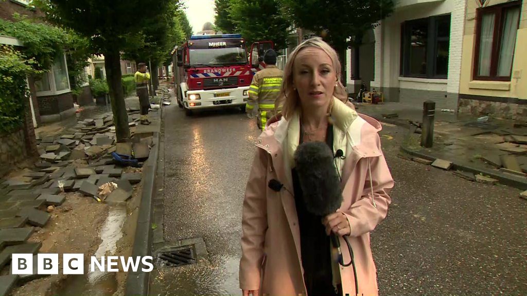 Europe floods: Neighbourhoods clear up after record rainfall