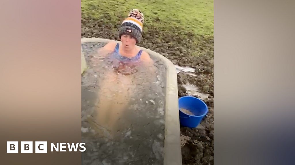 Cold Water Swimmer Takes Dip In Animal Troughs For Charity