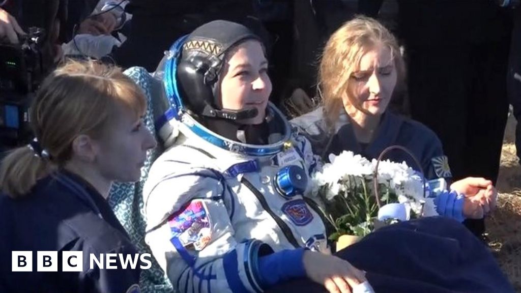 Russian team back on Earth after filming first movie in space