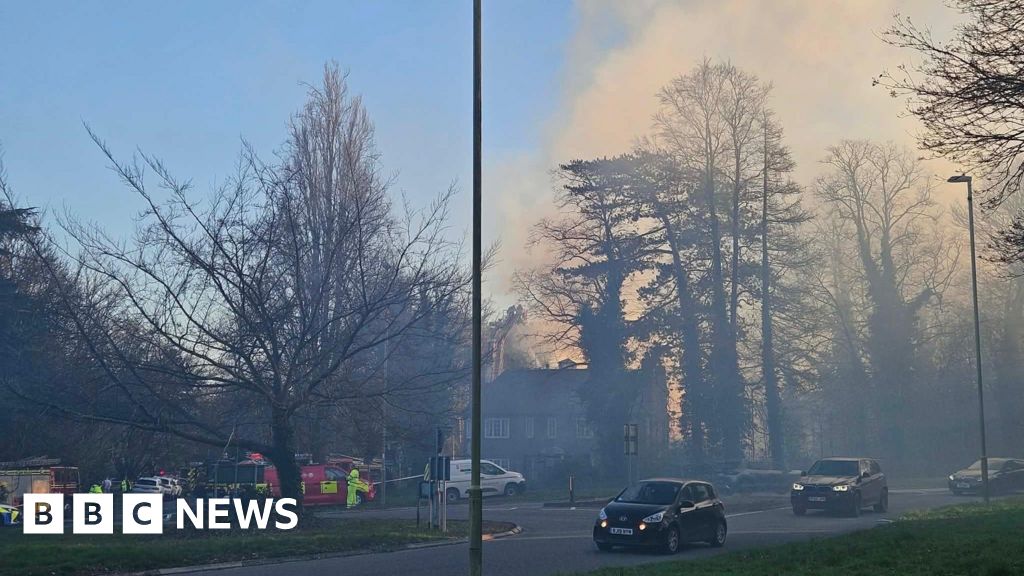 Fire engulfs historic thatched cottage as 60 firefighters battle flames