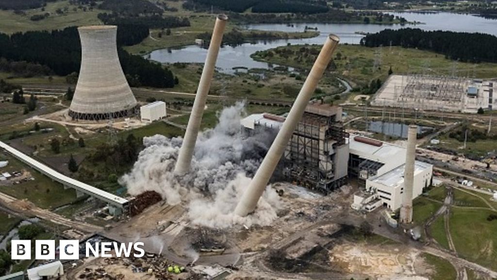 Australia power plant demolition sees giant chimneys tumble to ground