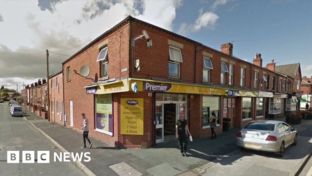 Police officer stabbed in Wigan armed robbery - BBC News