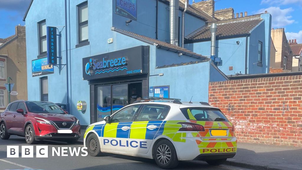 Police car photographed on double yellow lines at Redcar chippy