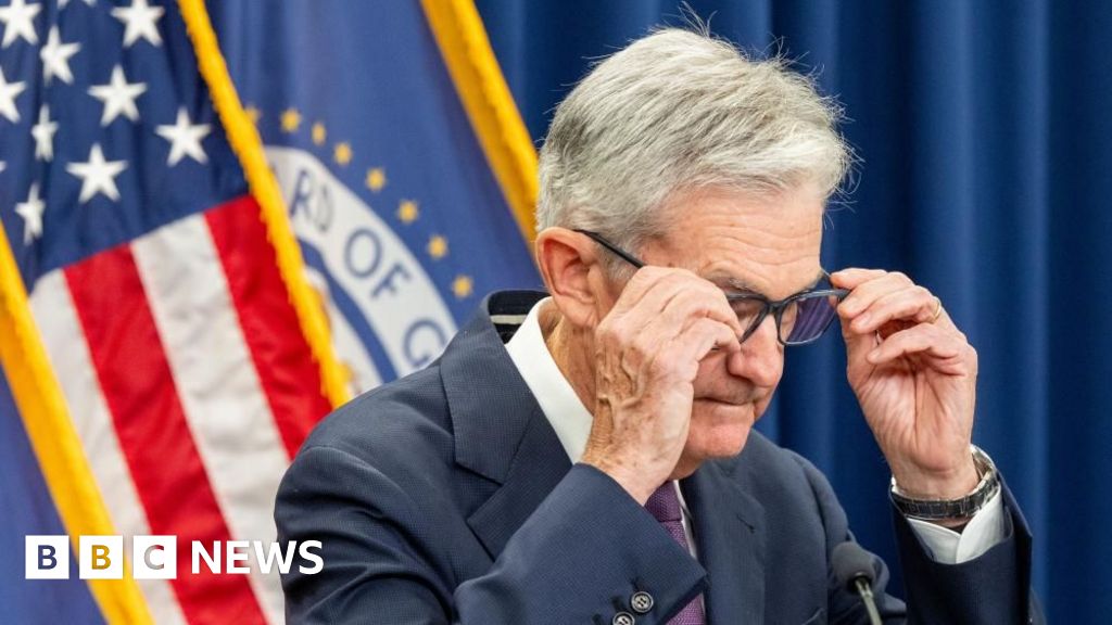 US central bank cuts interest rates but cautions over stalling job market