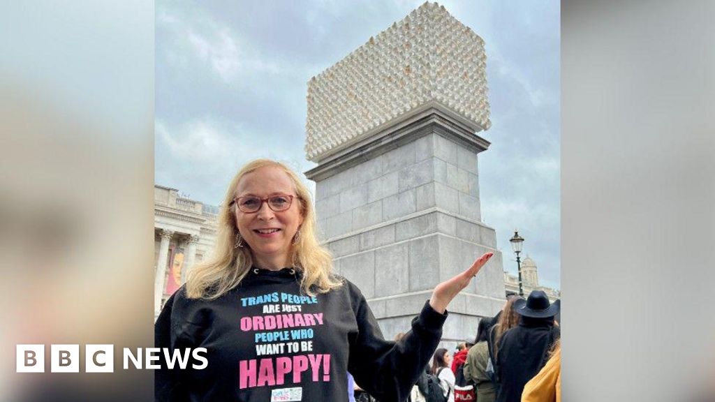 Katie Neeves standing in front of the newly-unveiled sculpture in Traflagar Square