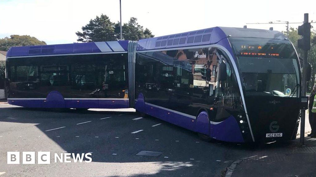 Glider bus gets stuck turning a corner BBC News