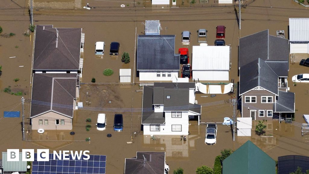 Record rains in Japan kill six, strand thousands