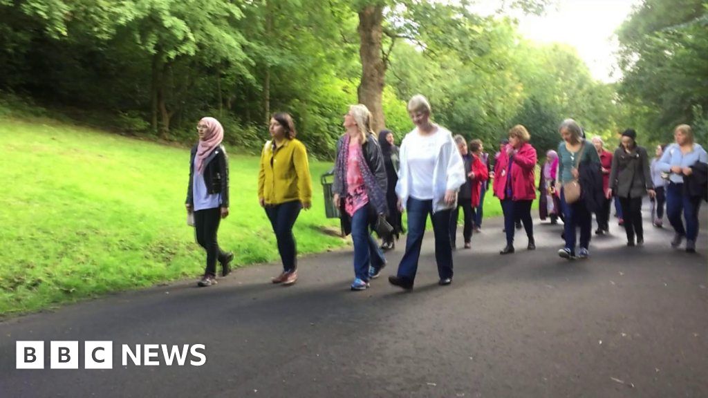 Christian and Muslim women walk together in Glasgow BBC News