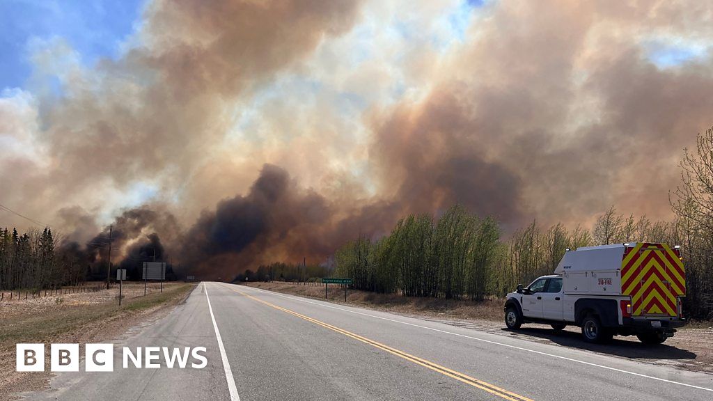 Alberta residents flee wildfires with newborn