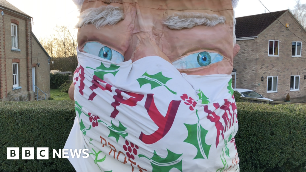 Covid Phone box turned into Santa with facemask in Prickwillow makeover