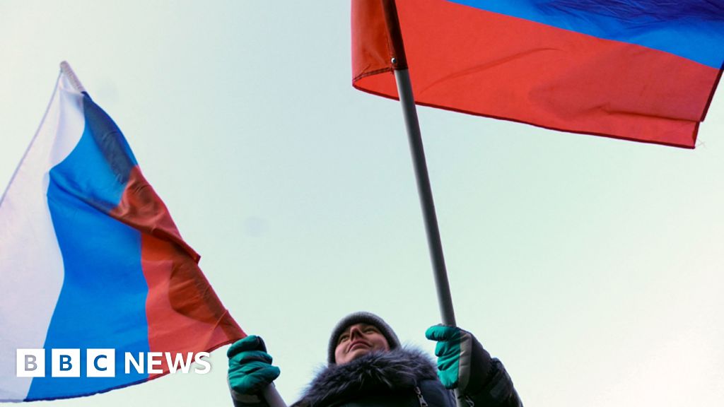 U.S. takes down mansion's flag, raises Russian dander