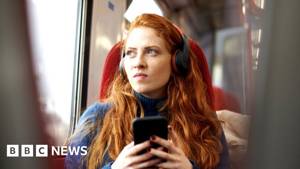 Woman looking concerned on train