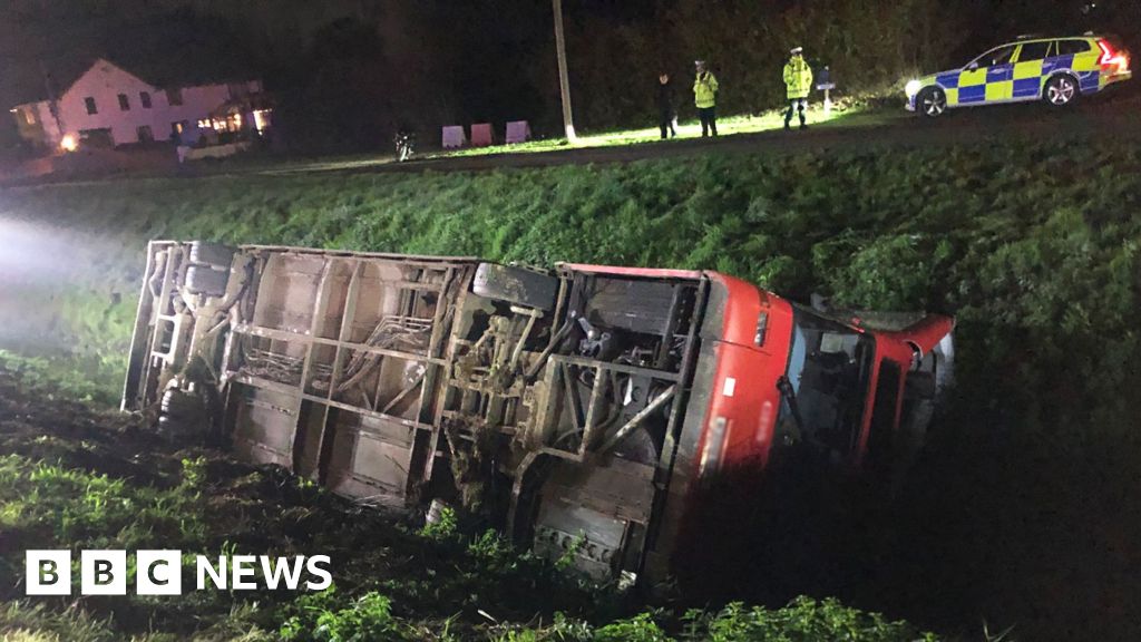 Six children rescued after bus crashes into ditch