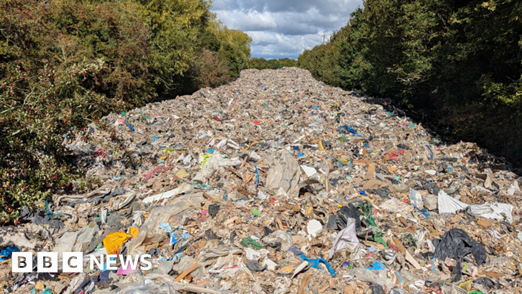 Man arrested over fly-tipped mountain of waste