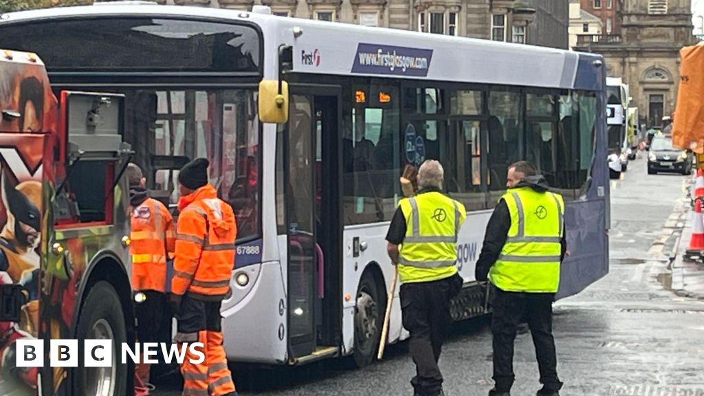 Bus crashes into Glasgow building, driver hospitalized