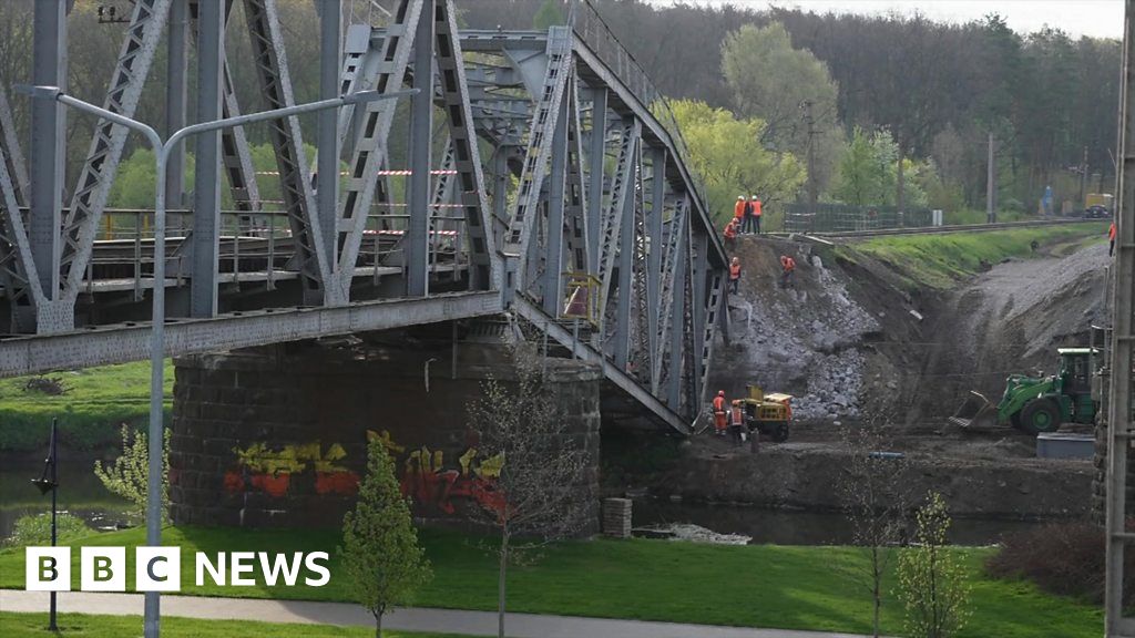 Ukraine war: Rebuilt Kyiv railway bridge a symbol of hope