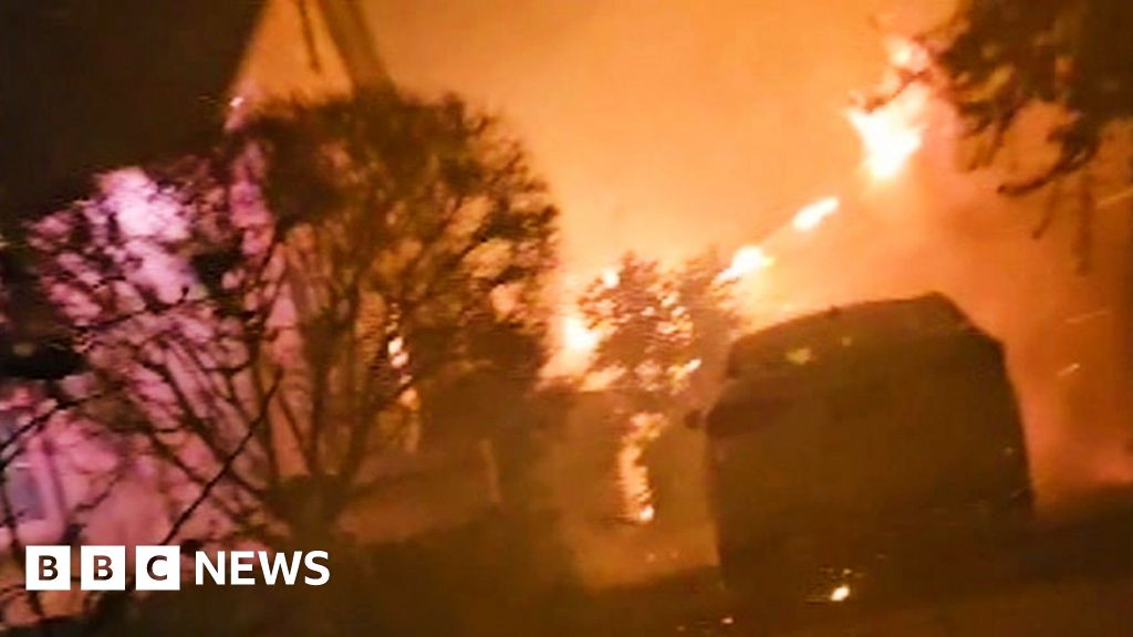 Moment man’s saved from burning LA home