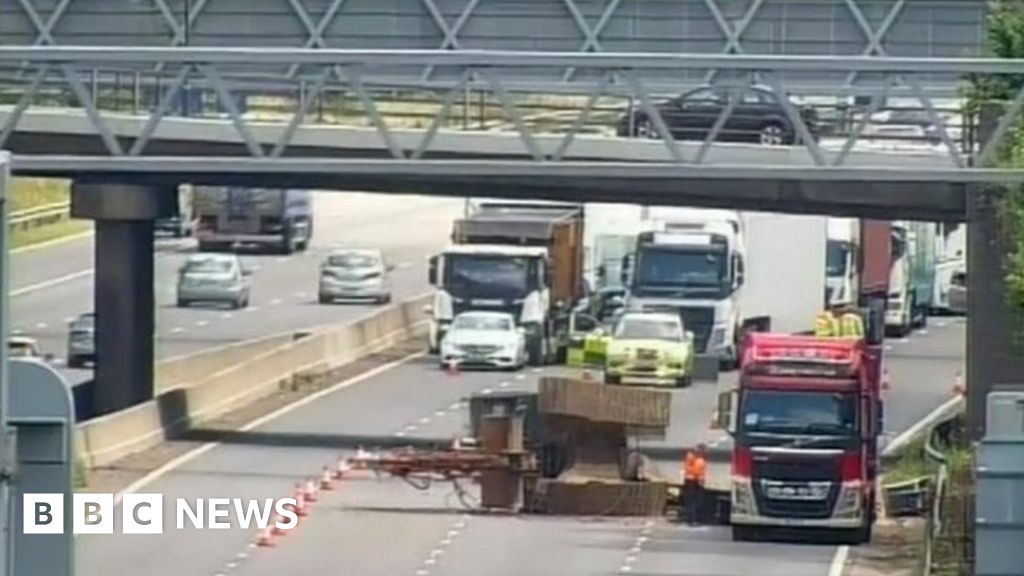 M6 shut as lorry carrying machinery hits bridge BBC News