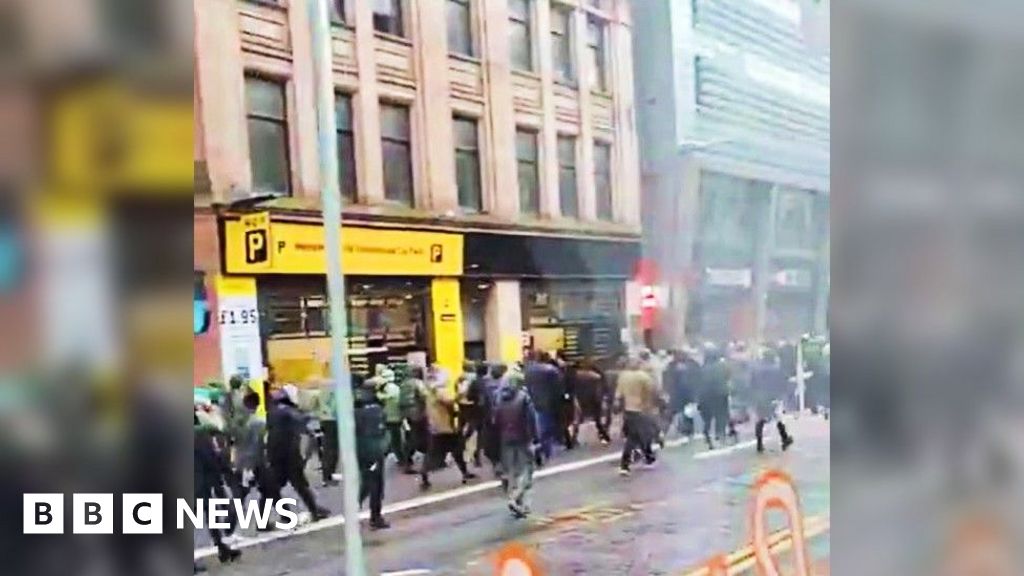 Football fans throw missiles in pre-match violence