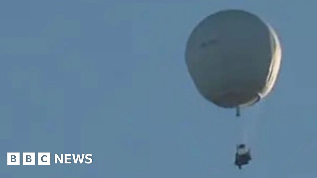 Why was a white balloon flying across the UK?