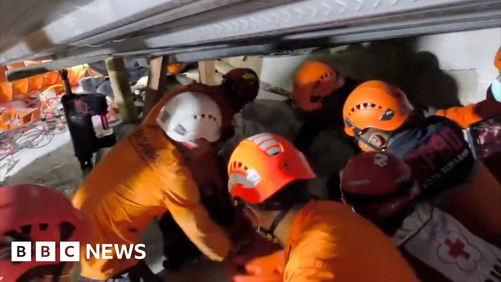 Indonesia school collapse: See three trapped students' rescue