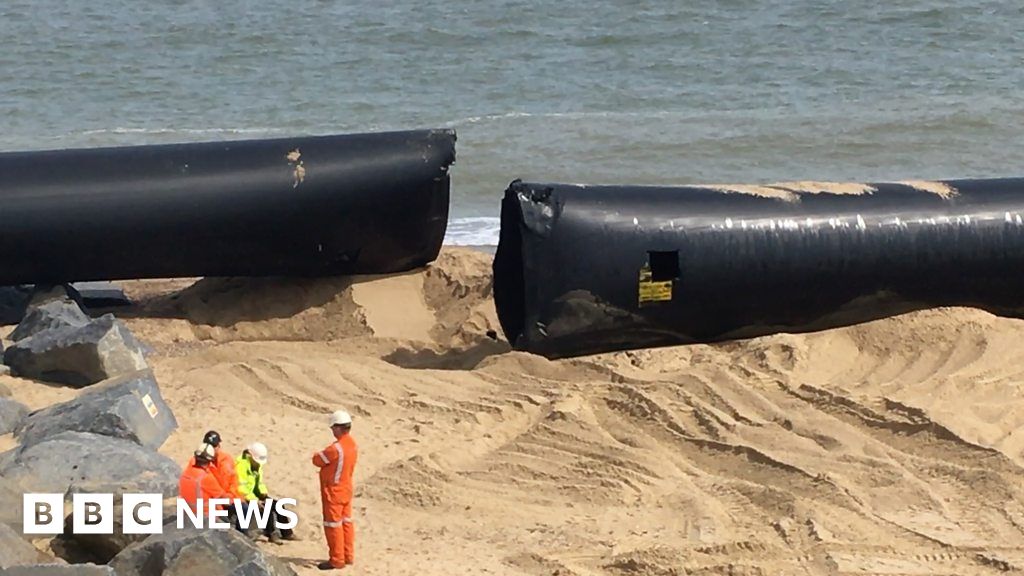 Recovery Of Giant Pipes That Washed Up On Norfolk Beaches Begins Bbc News