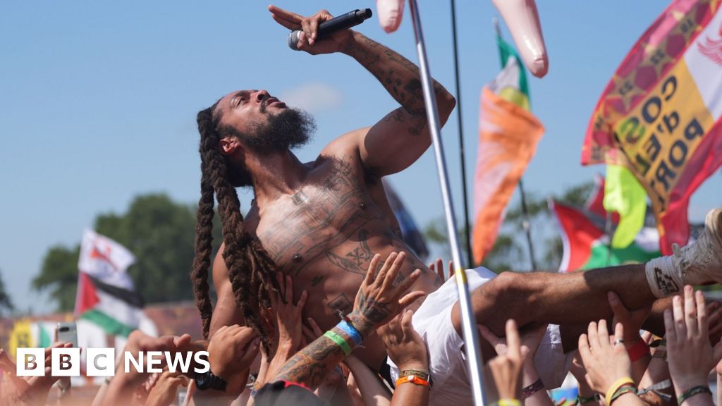 Police review footage of chants led by Glastonbury acts