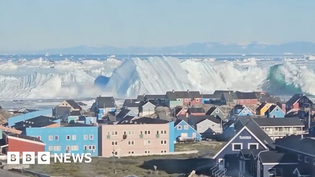 Watch: Giant iceberg turns over near Greenland's coast