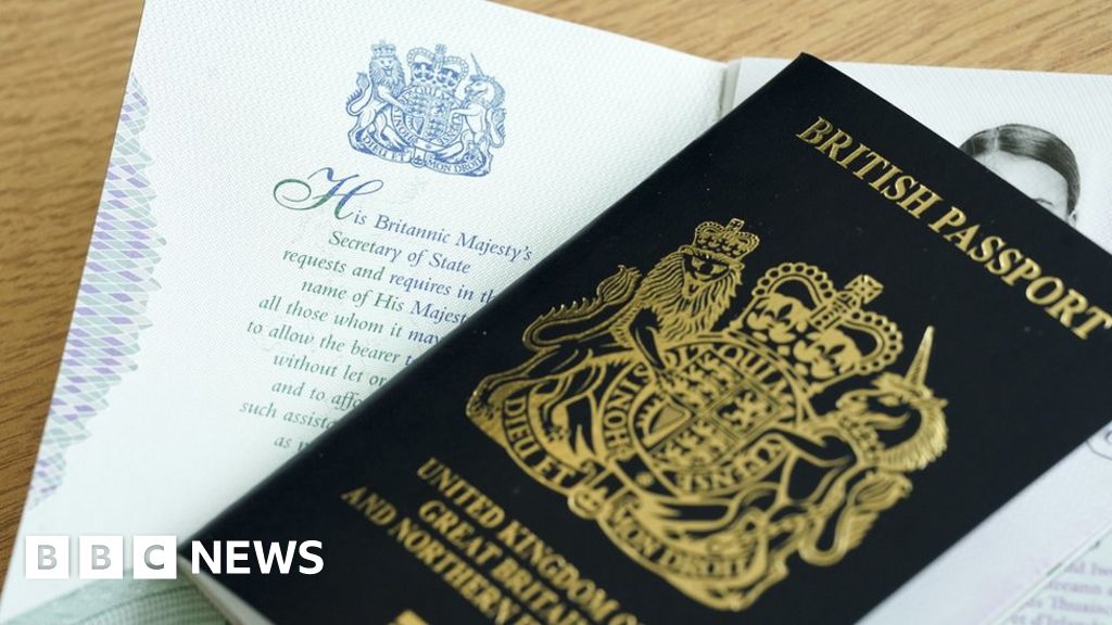 First British passports issued with King's name