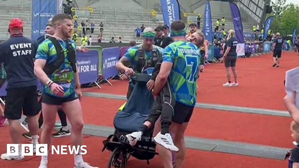 Rob Burrow carried over marathon finish by Sinfield