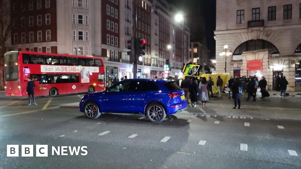 Ambulance overturns after colliding with bus in Westminster