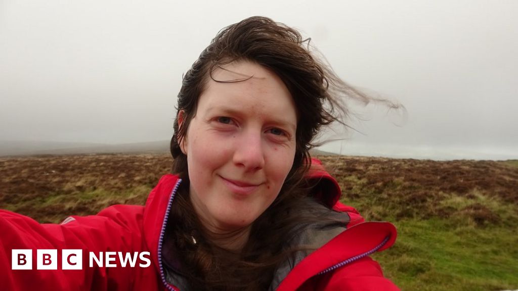 Woman 'first to walk all Dartmoor tors' for rescue charity - BBC News