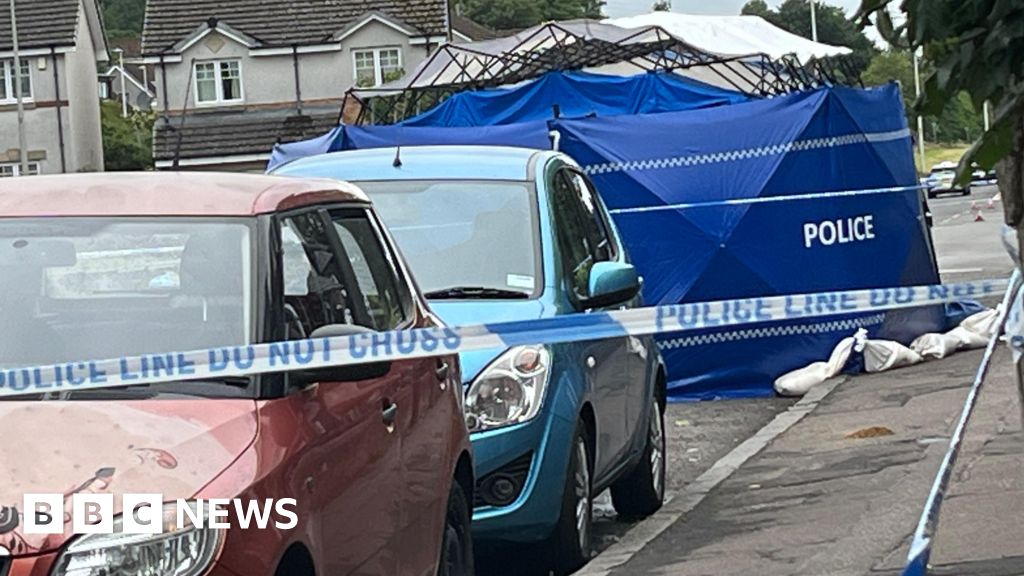 Man arrested after death of woman found injured on street