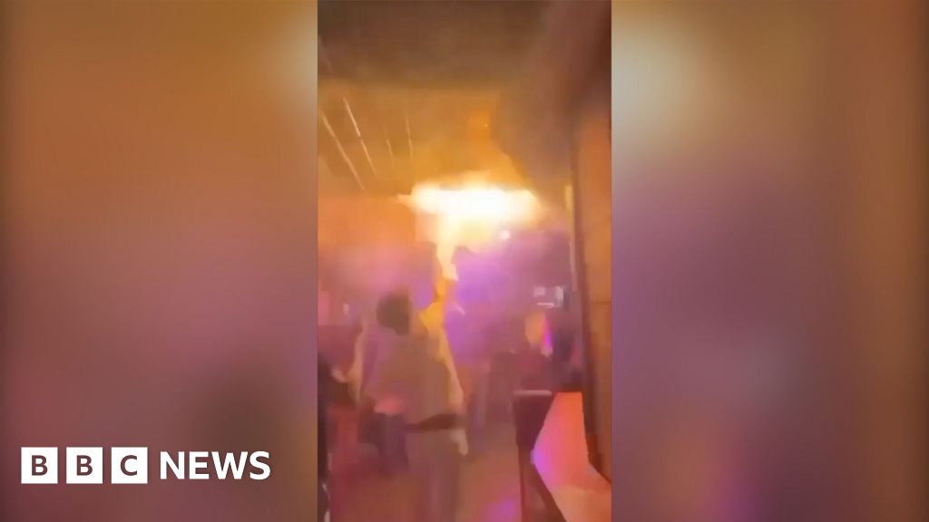 Watch: Footage shows partygoer trying to put out flames