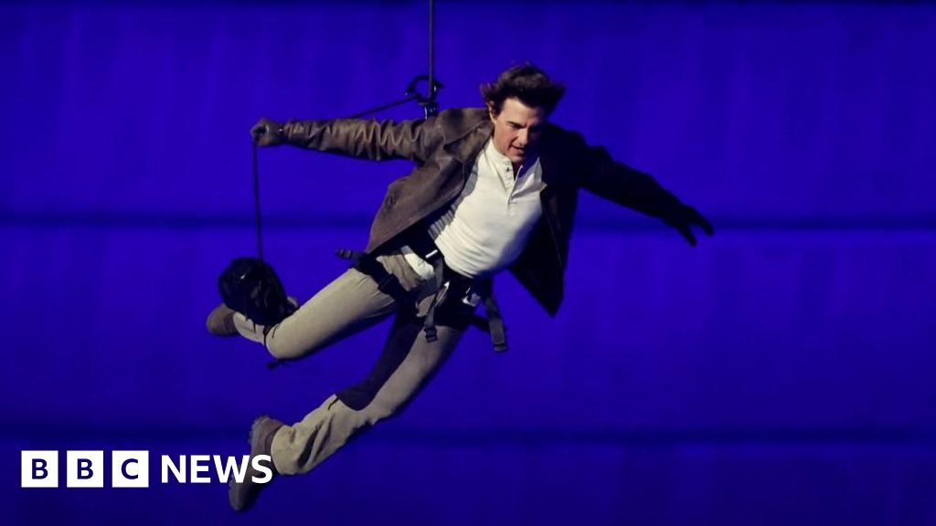 Tom Cruise descends from stadium roof in daring Olympic finale