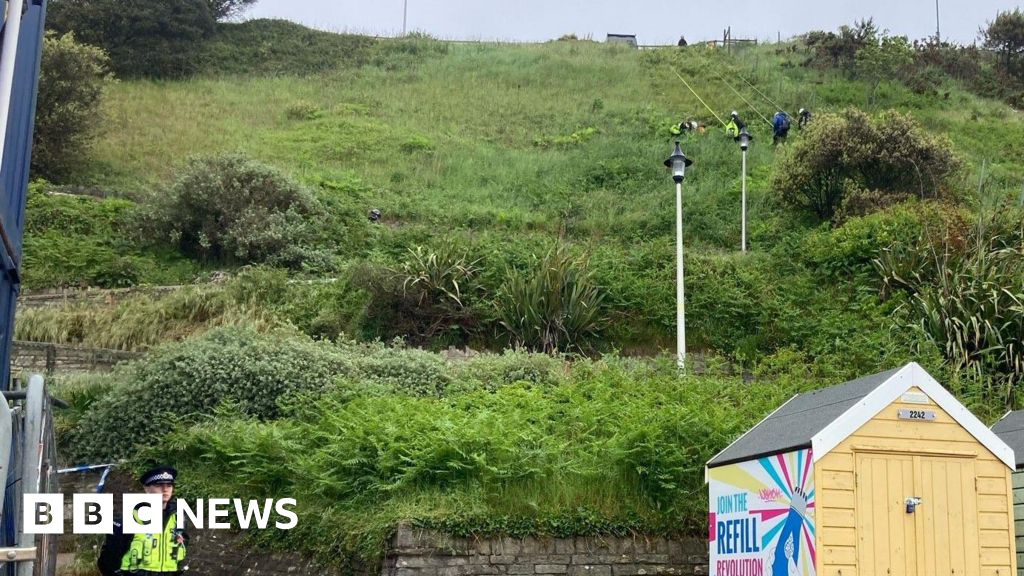 Police search cliffs after fatal beach stabbing