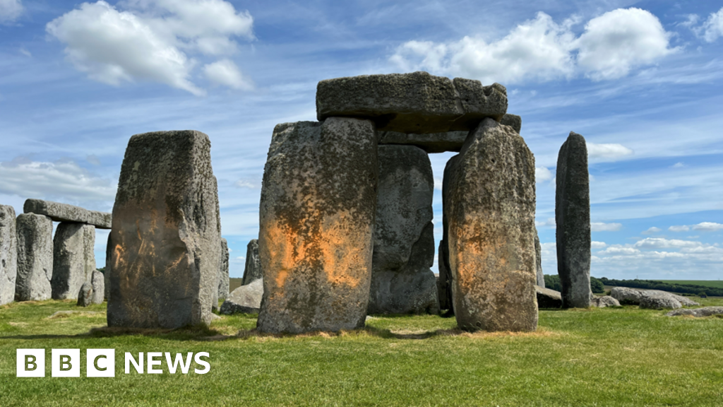 Just Stop Oil trio cleared over Stonehenge orange powder protest