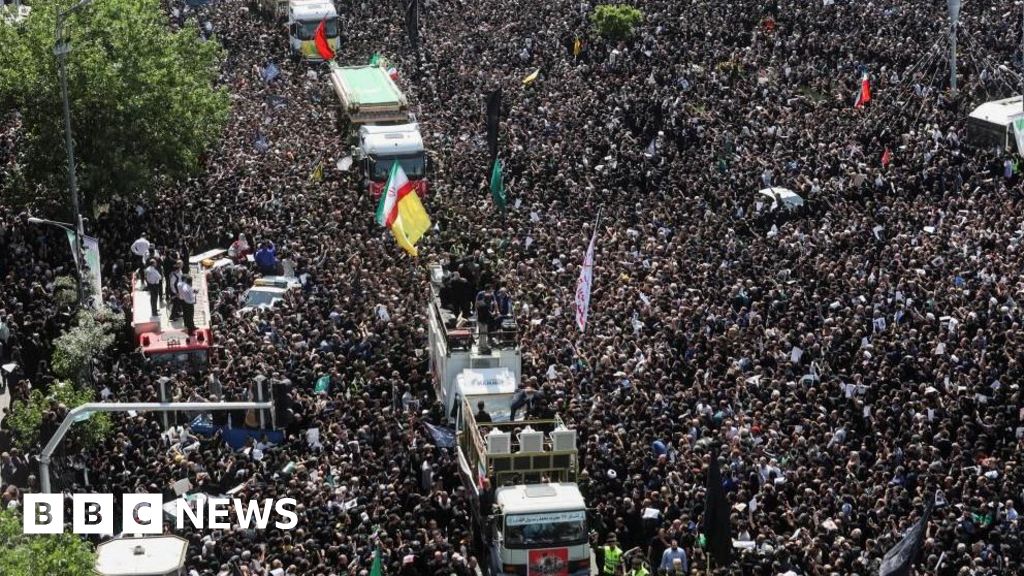 Iran's supreme leader leads prayers at Raisi funeral